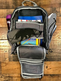Backpack open showing everything that fits