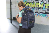 Woman wearing Navy military backpack showing left side